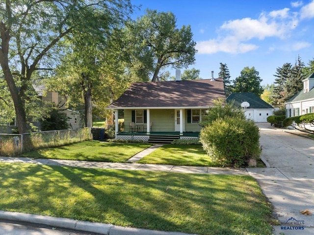 view of front of property with a front yard and covered porch