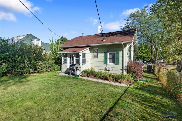 914 Kingsbury St, Belle Fourche, SD 57717 - back of house with a lawn and fence