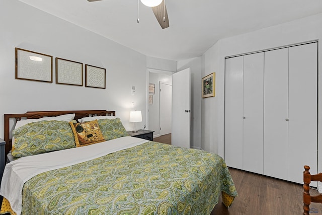 bedroom featuring ceiling fan, dark hardwood / wood-style floors, and a closet