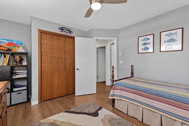 bedroom featuring a closet, light wood-type flooring, and ceiling fan