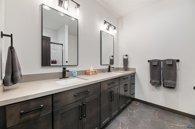 bathroom featuring an enclosed shower and vanity