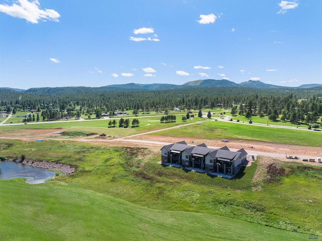 property view of mountains featuring a water view and a rural view