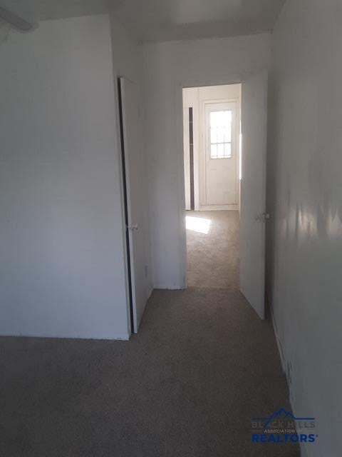 hallway with carpet