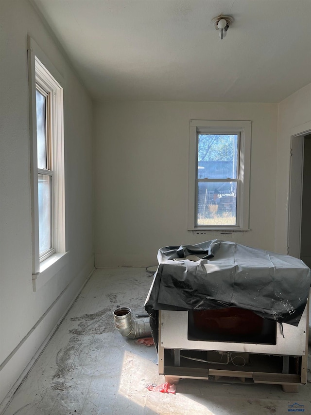 bedroom with multiple windows