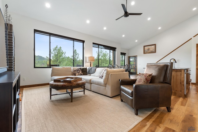 23974 Thompson Dr, Hill City, SD 57745 - living area featuring recessed lighting, light wood-style flooring, ceiling fan, and high vaulted ceiling