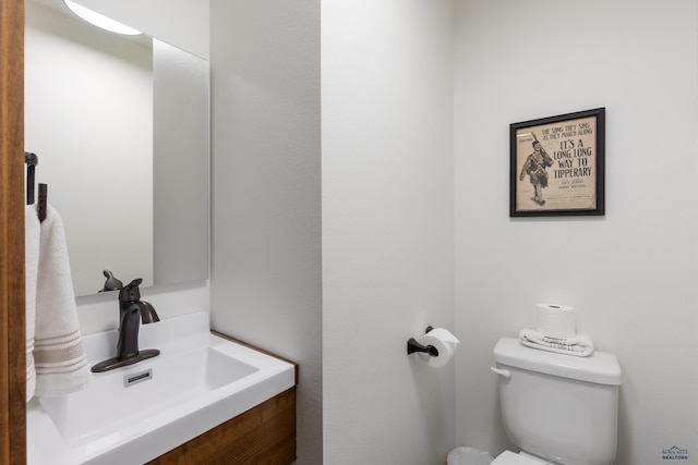 23974 Thompson Dr, Hill City, SD 57745 - half bathroom featuring toilet and vanity