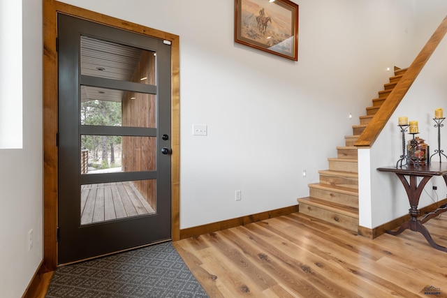 23974 Thompson Dr, Hill City, SD 57745 - foyer entrance with wood finished floors and stairs