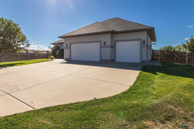 view of property exterior featuring a lawn and a garage