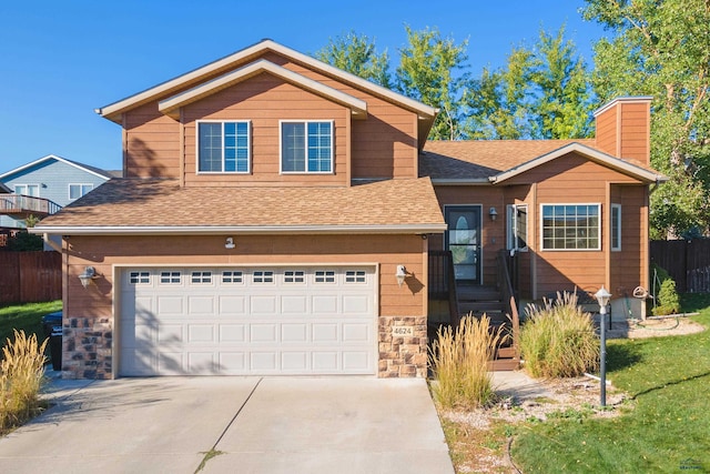 view of front facade featuring a front lawn and a garage