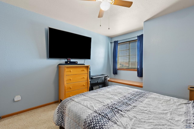 bedroom featuring ceiling fan and carpet floors