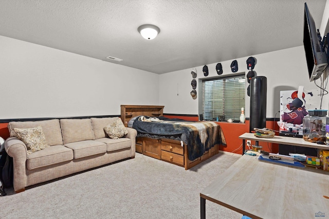 carpeted bedroom featuring a textured ceiling