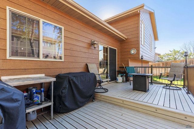 deck featuring a grill