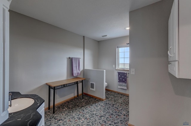 11845 N Haines Ave, Rapid City, SD 57701 - bathroom featuring vanity, visible vents, baseboards, and toilet