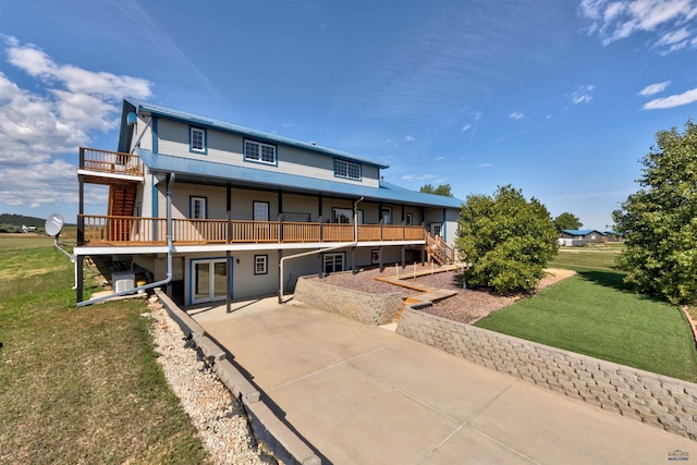 11845 N Haines Ave, Rapid City, SD 57701 - rear view of property with concrete driveway, a patio, stairway, and a lawn
