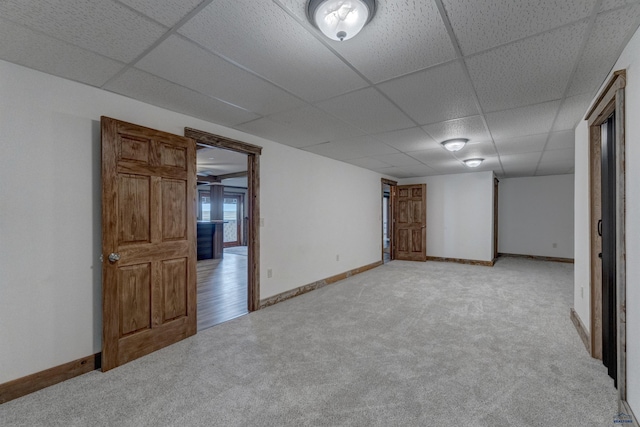 11845 N Haines Ave, Rapid City, SD 57701 - empty room with baseboards, a drop ceiling, and light carpet