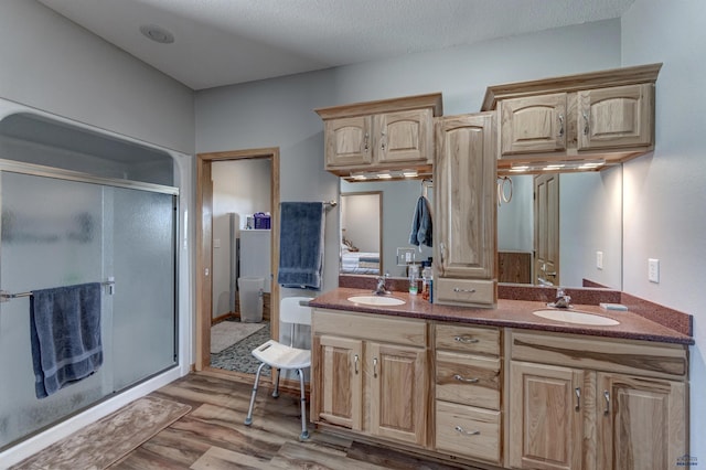 11845 N Haines Ave, Rapid City, SD 57701 - full bathroom with a stall shower, wood finished floors, and a sink