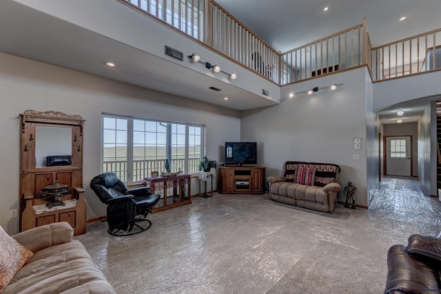 11845 N Haines Ave, Rapid City, SD 57701 - living area featuring visible vents, baseboards, recessed lighting, and a towering ceiling