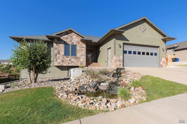 view of front of property with a garage and a front yard