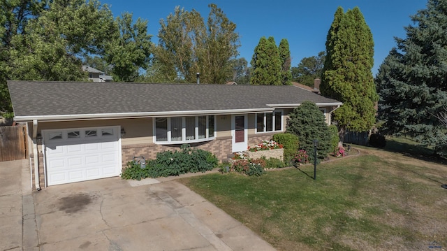 ranch-style house with a garage and a front yard