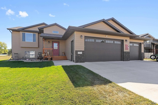 view of front facade with a garage and a front lawn