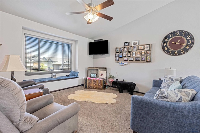 living room with lofted ceiling, ceiling fan, and carpet floors