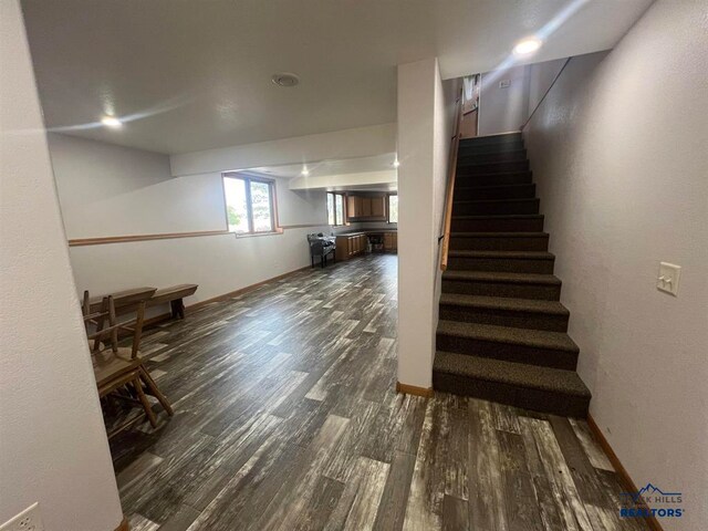 staircase featuring hardwood / wood-style floors