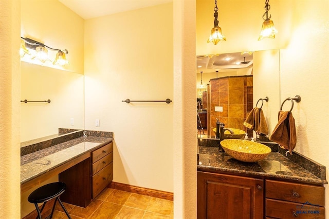 bathroom featuring tile patterned flooring and vanity