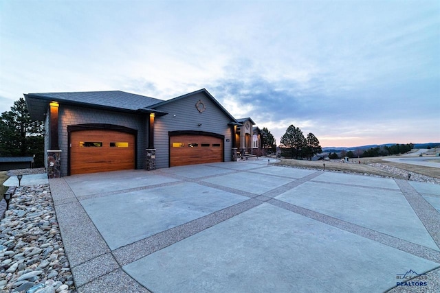 property exterior at dusk with a garage