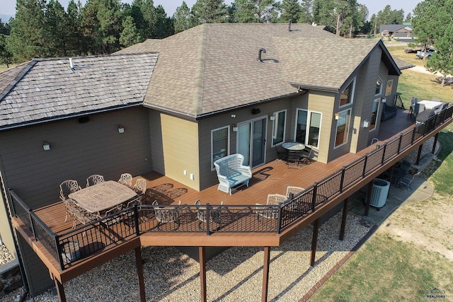 rear view of property with cooling unit, an outdoor living space, and a deck