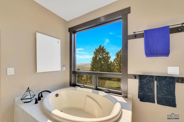 bathroom featuring a relaxing tiled tub