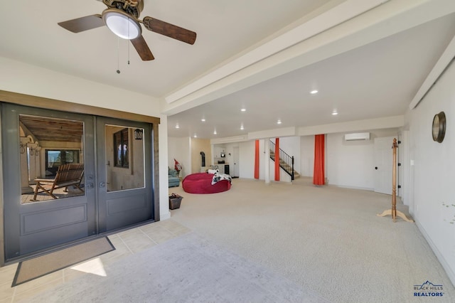 entrance to property featuring an AC wall unit, ceiling fan, and a patio