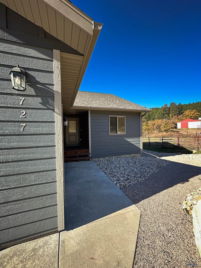 entrance to property featuring a patio area