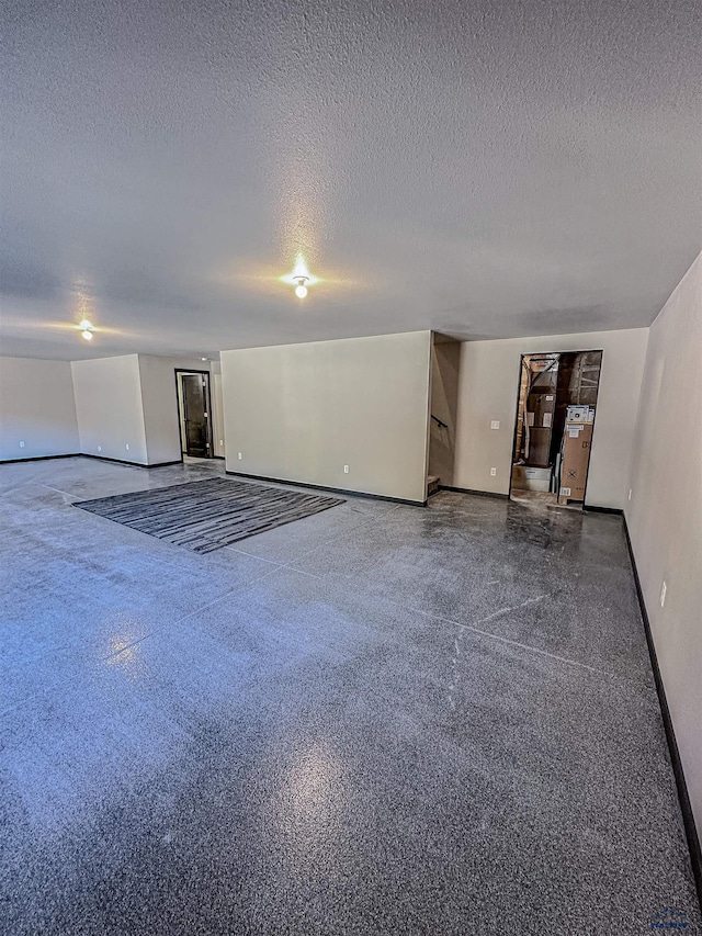 spare room with a textured ceiling