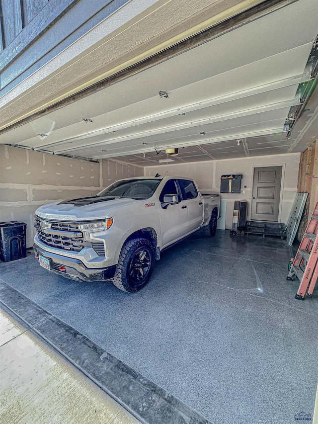 garage featuring a garage door opener