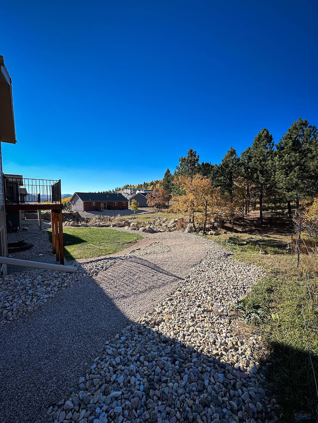 view of yard with a wooden deck