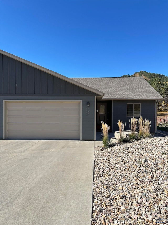 ranch-style house featuring a garage