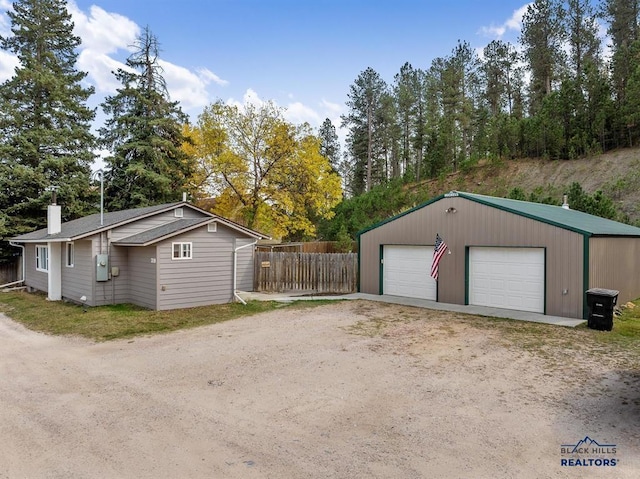 detached garage with fence
