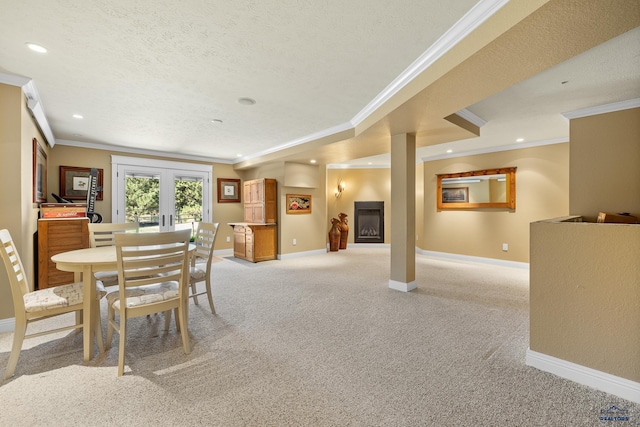 dining space featuring ornamental molding, french doors, light carpet, and a textured ceiling