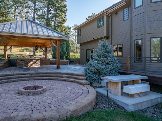 view of patio / terrace featuring a gazebo and a fire pit