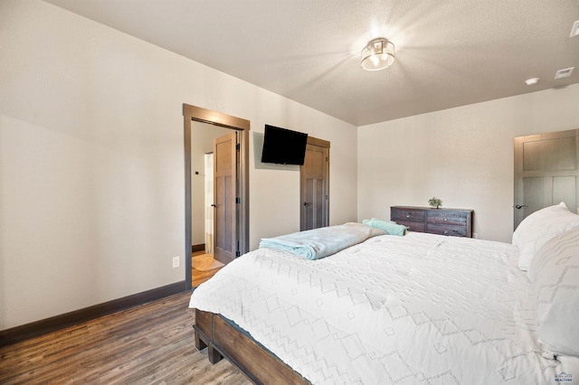 bedroom featuring hardwood / wood-style floors