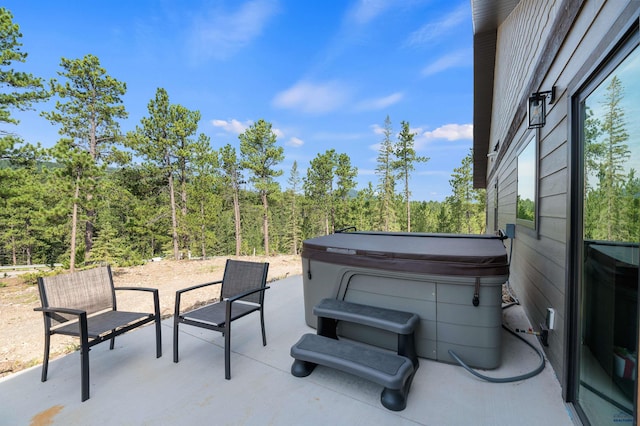 view of patio / terrace featuring a hot tub