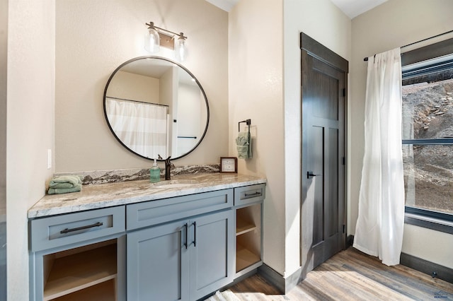 bathroom featuring vanity and hardwood / wood-style floors