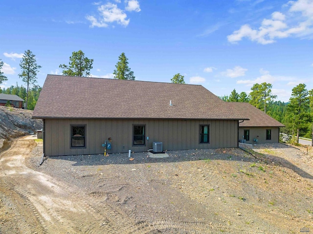 back of house with cooling unit