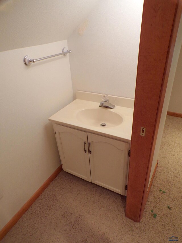 415 Spark St, Lead, SD 57754 - bathroom with vanity, baseboards, and carpet floors