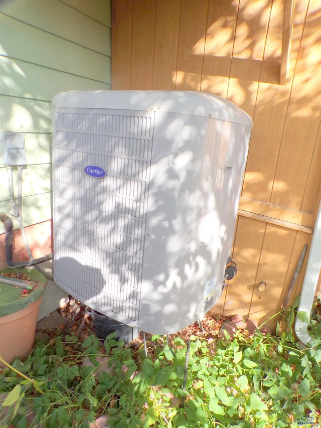 details with wood walls and central AC unit