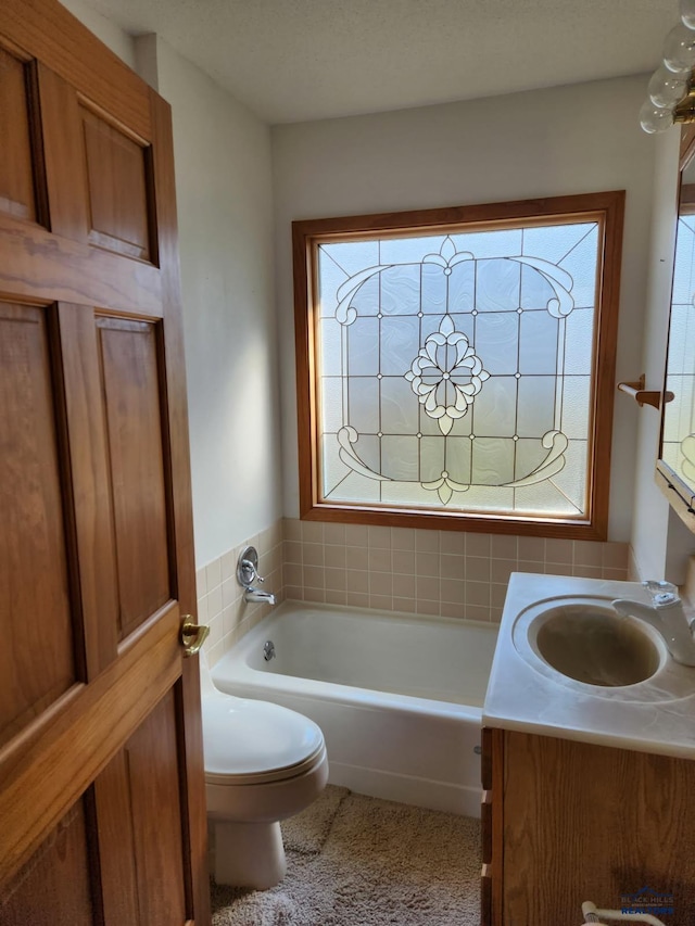 415 Spark St, Lead, SD 57754 - full bathroom with a tub, toilet, and vanity