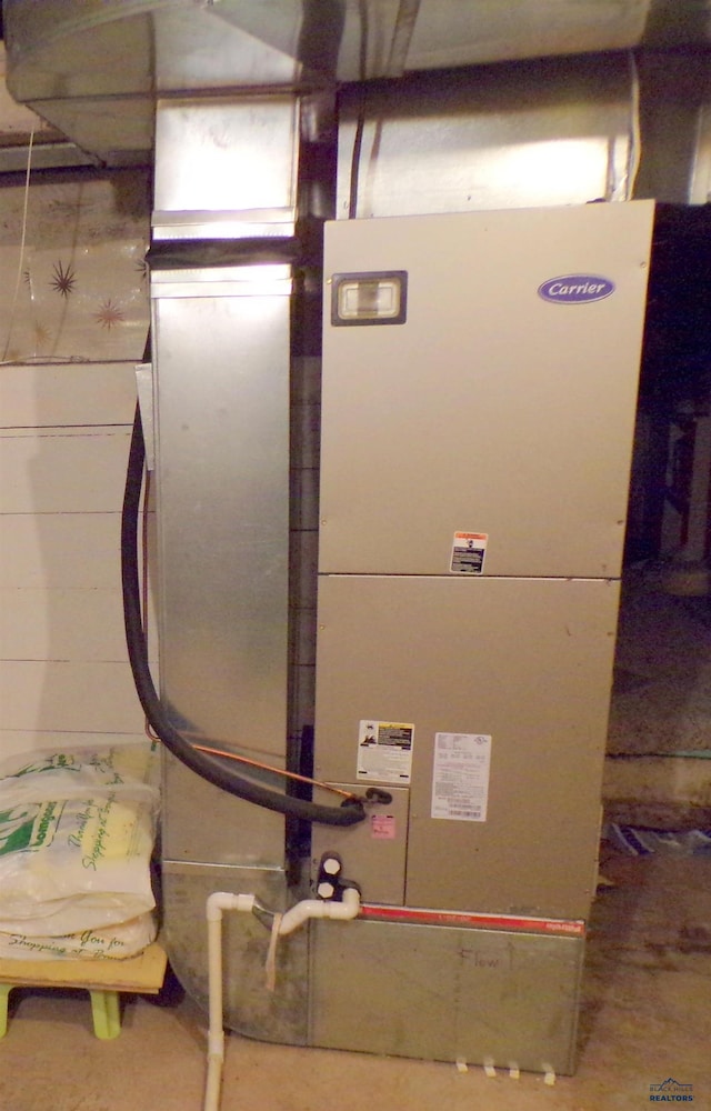 utility room with heating unit