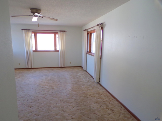 415 Spark St, Lead, SD 57754 - spare room featuring plenty of natural light, light colored carpet, ceiling fan, and a textured ceiling