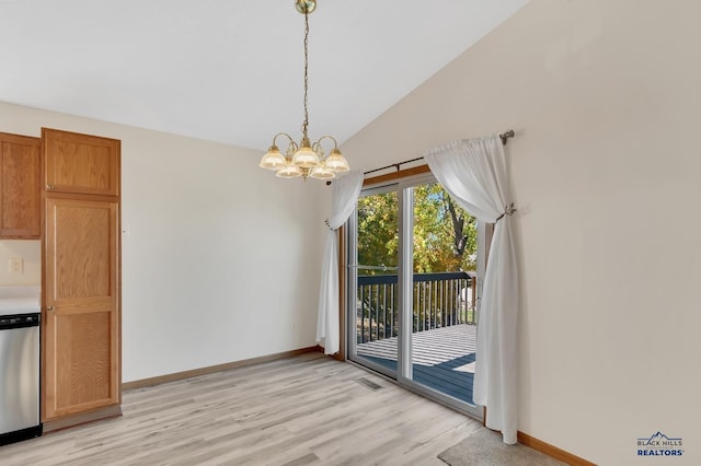 unfurnished dining area with an inviting chandelier, light hardwood / wood-style flooring, and vaulted ceiling