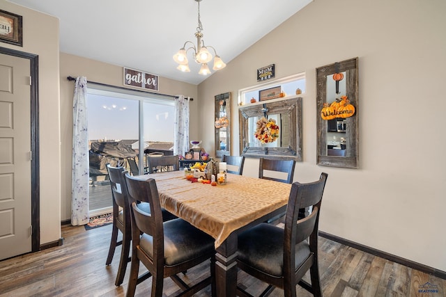 dining space featuring a notable chandelier, vaulted ceiling, and dark hardwood / wood-style flooring